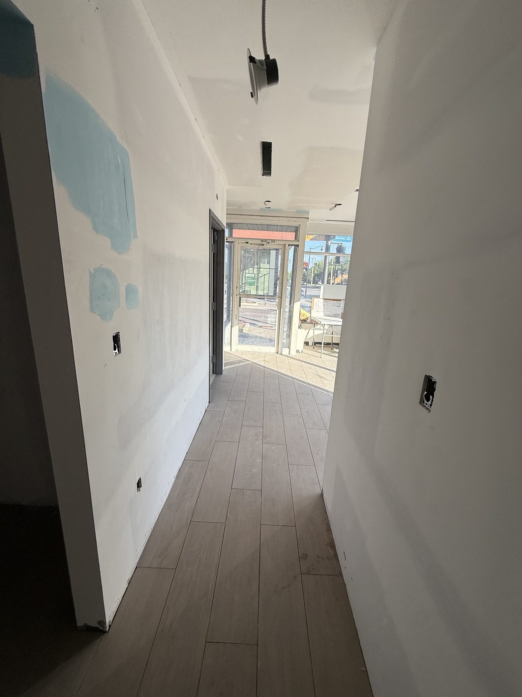 Finished hallway leading toward the front of the dental clinic